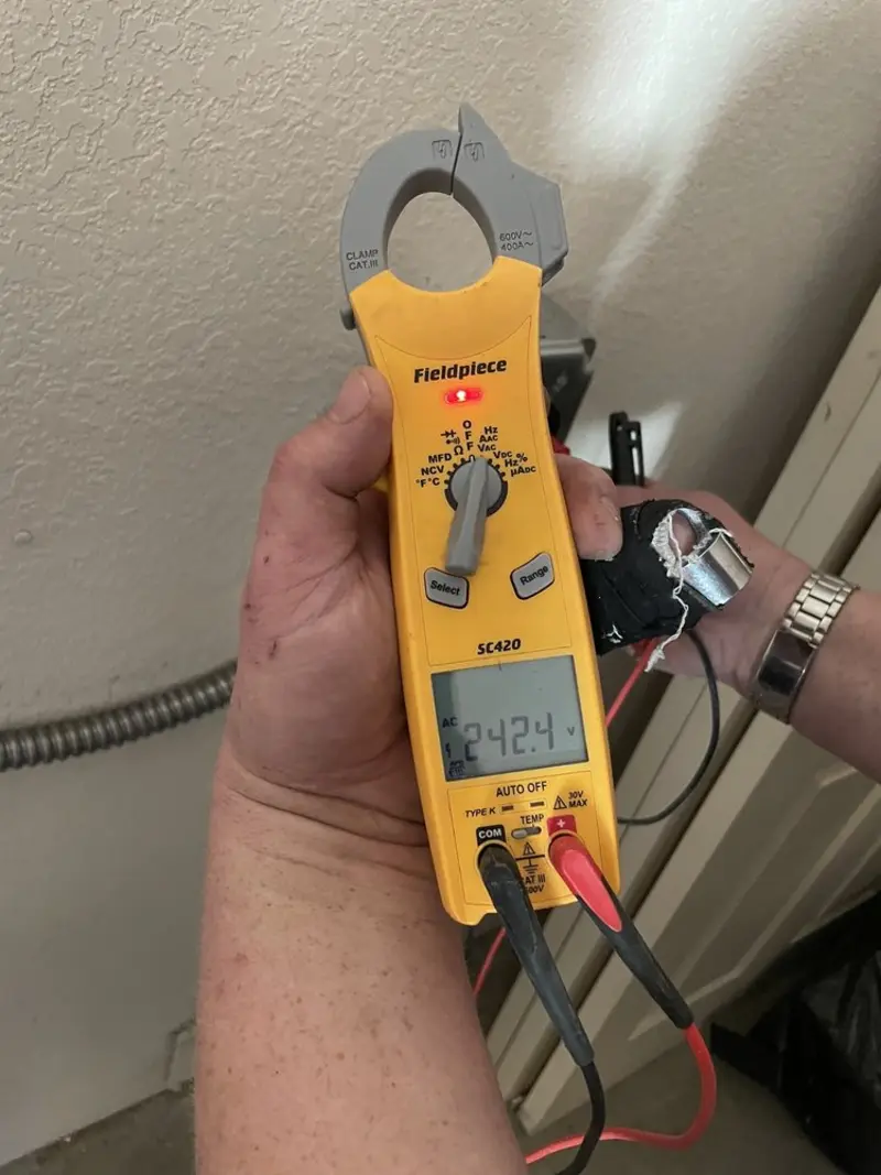 Voltage testing with clamp meter during Electrical Installation Services in Lehigh Acres